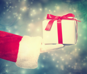 Santa Claus Giving A Christmas Gift