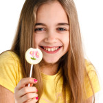 blonde girl with a lollipop