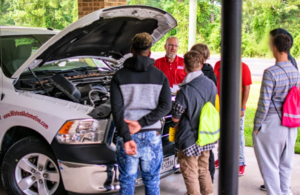 Teens learning about auto basics from Milstead Automotive