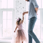 Dad dancing with daughter