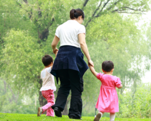 Mom walking with two kids