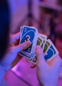 Teen playing uno